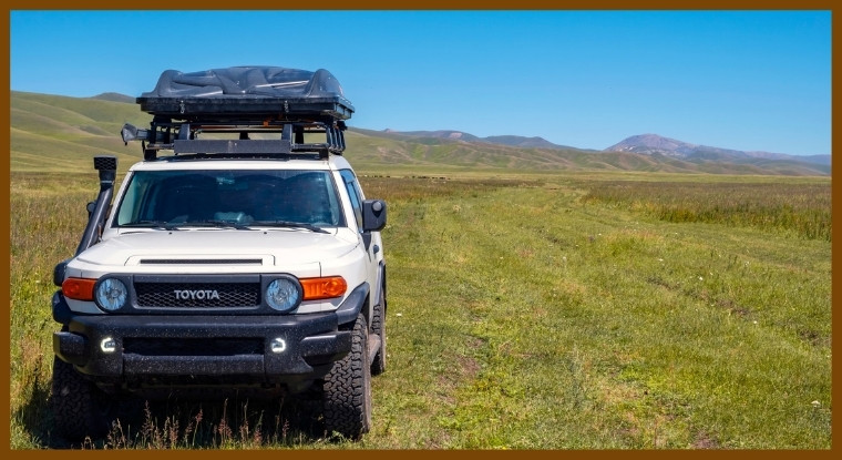 A toyota fj cruiser with roof top tent